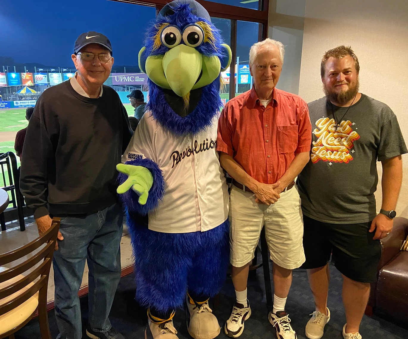 Mens Bible Study group with revs mascot