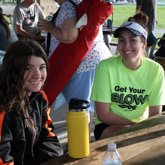 youth group smiling at picnic table